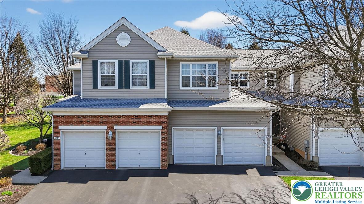 4312 Creek Road Allentown, PA 18104 - Photo 66 of 67 a front view of a house with a yard and garage