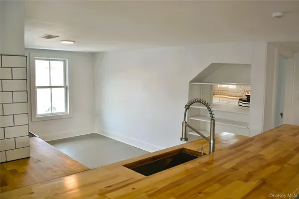 a kitchen with a stove a sink and a refrigerator
