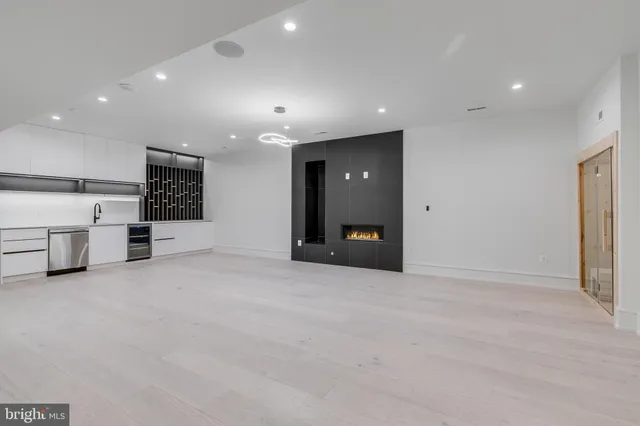 an empty room with wooden floor