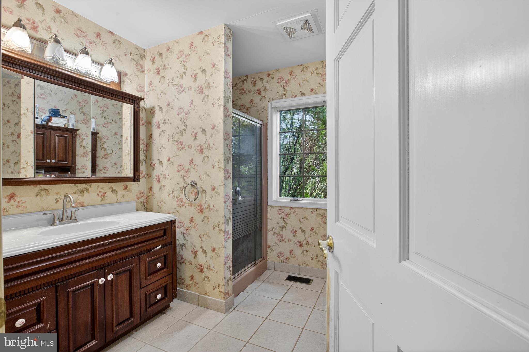 216 Revere Road Marlton, NJ 08053 - Photo 27 of 47 a spacious bathroom with a sink a mirror and a shower