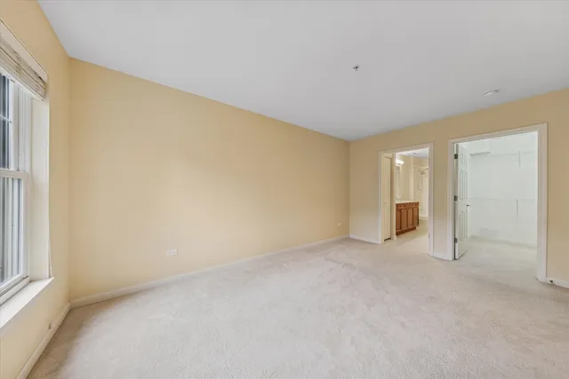 a view of an empty room and a window