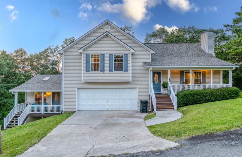 1856 Talona Mountain Road Ellijay, GA 30536 - Photo 1 of 1 a front view of a house with a yard