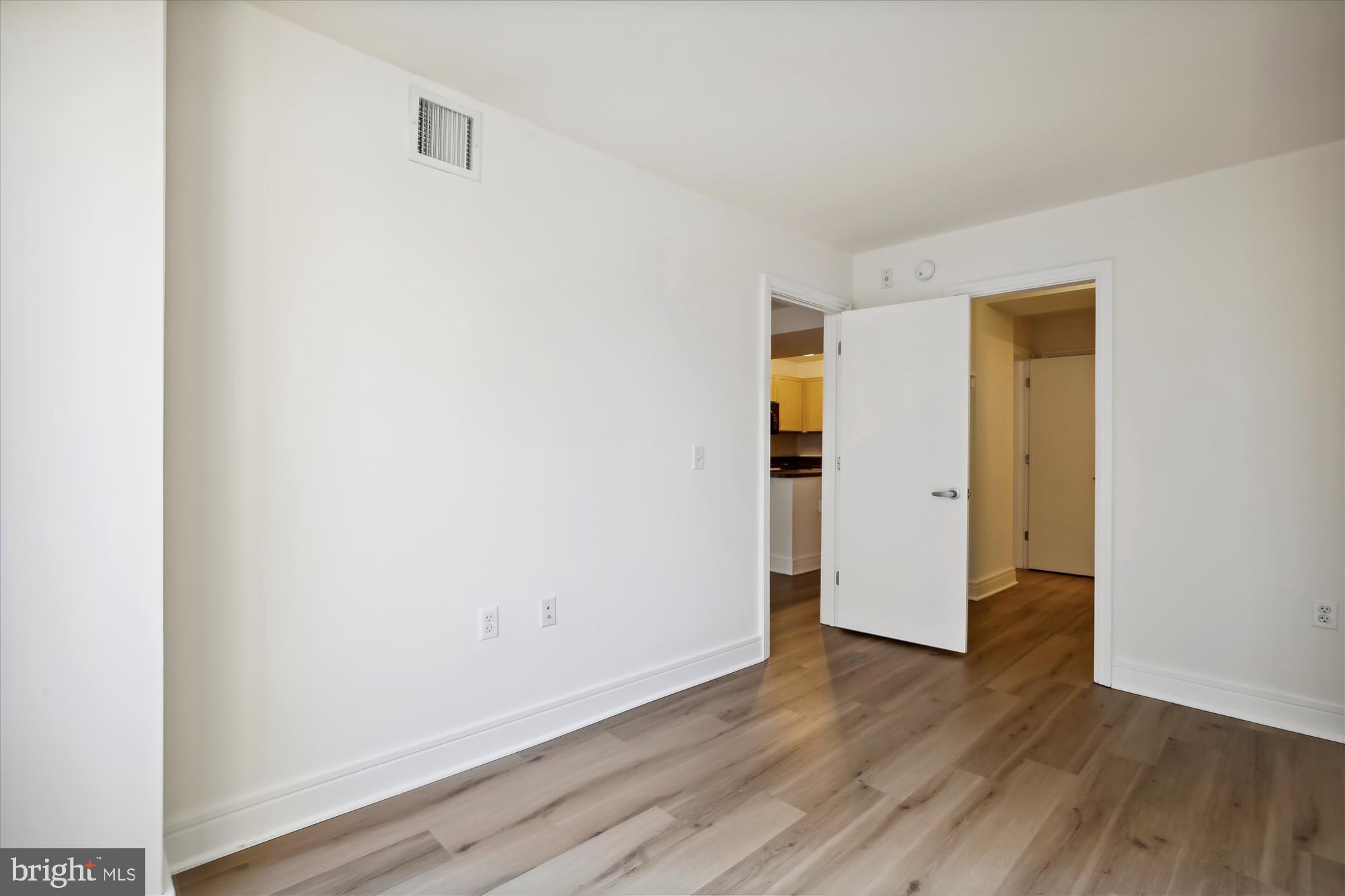 800 4th Street Southwest, Unit S113 Washington, DC 20024 - Photo 11 of 37 a view of an empty room with wooden floor and closet