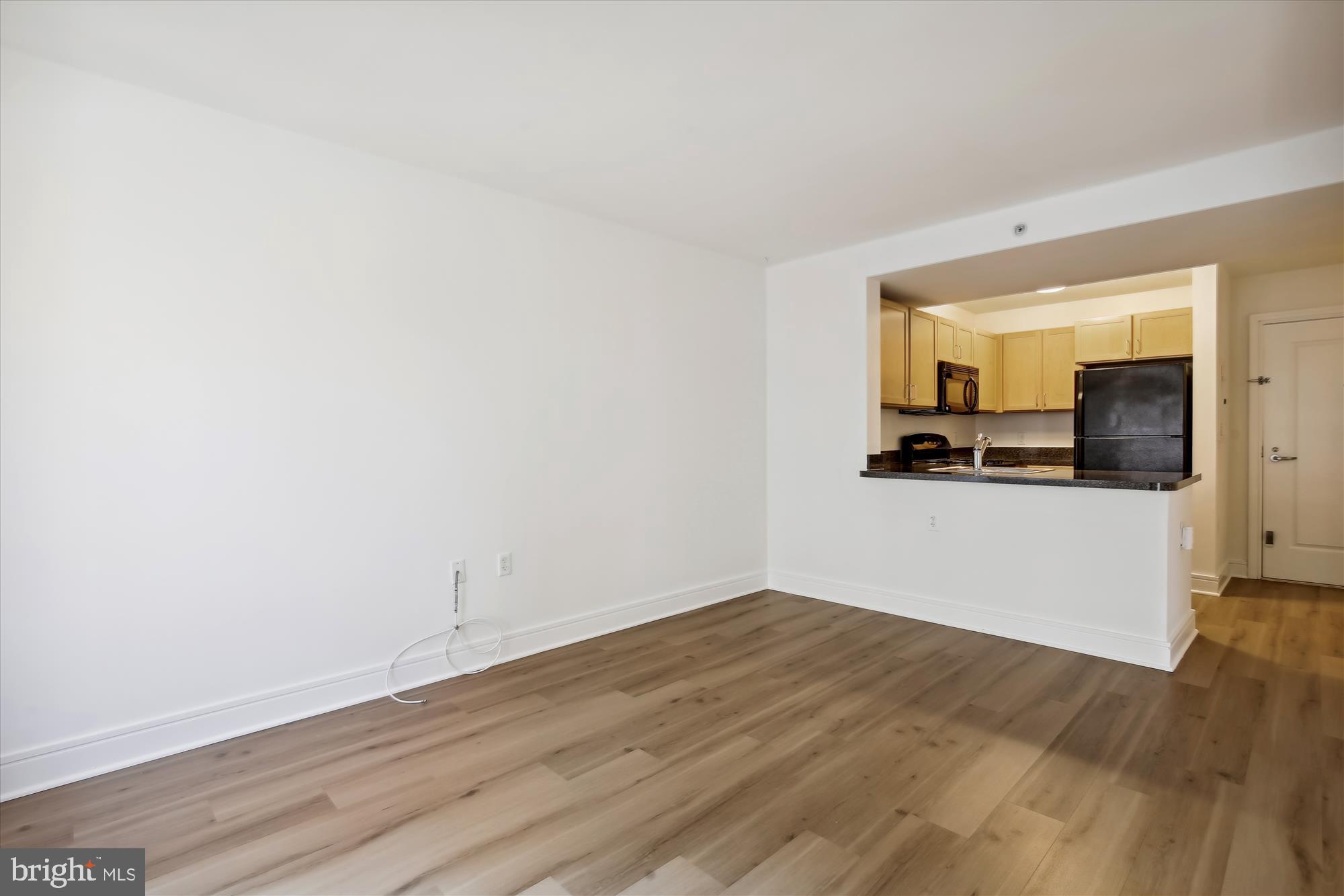 800 4th Street Southwest, Unit S113 Washington, DC 20024 - Photo 15 of 37 a view of a kitchen with wooden floor and a sink