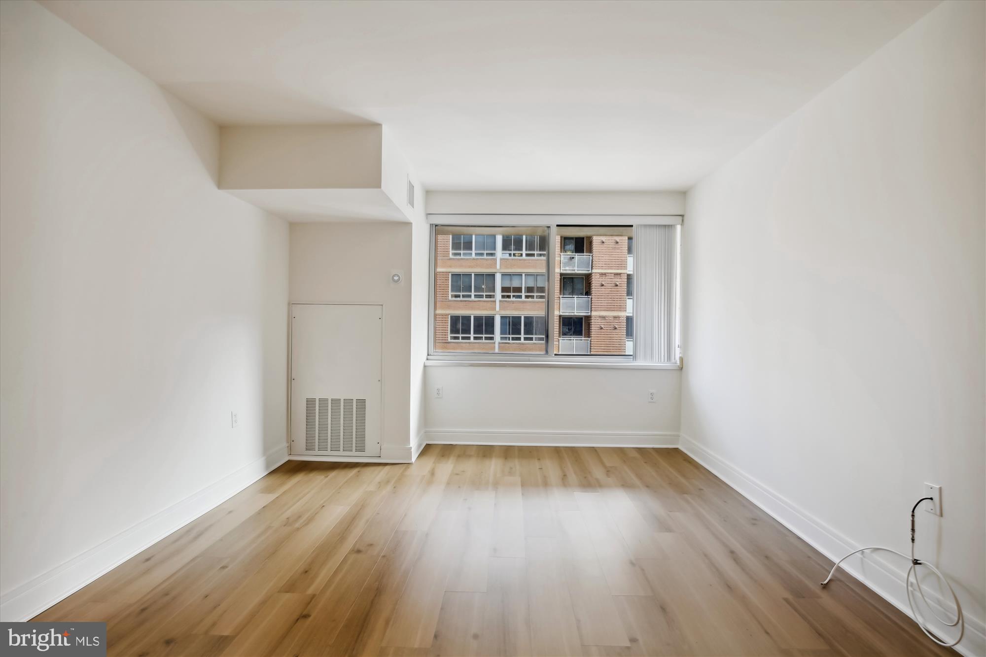 800 4th Street Southwest, Unit S113 Washington, DC 20024 - Photo 16 of 37 a view of empty room with wooden floor and fan