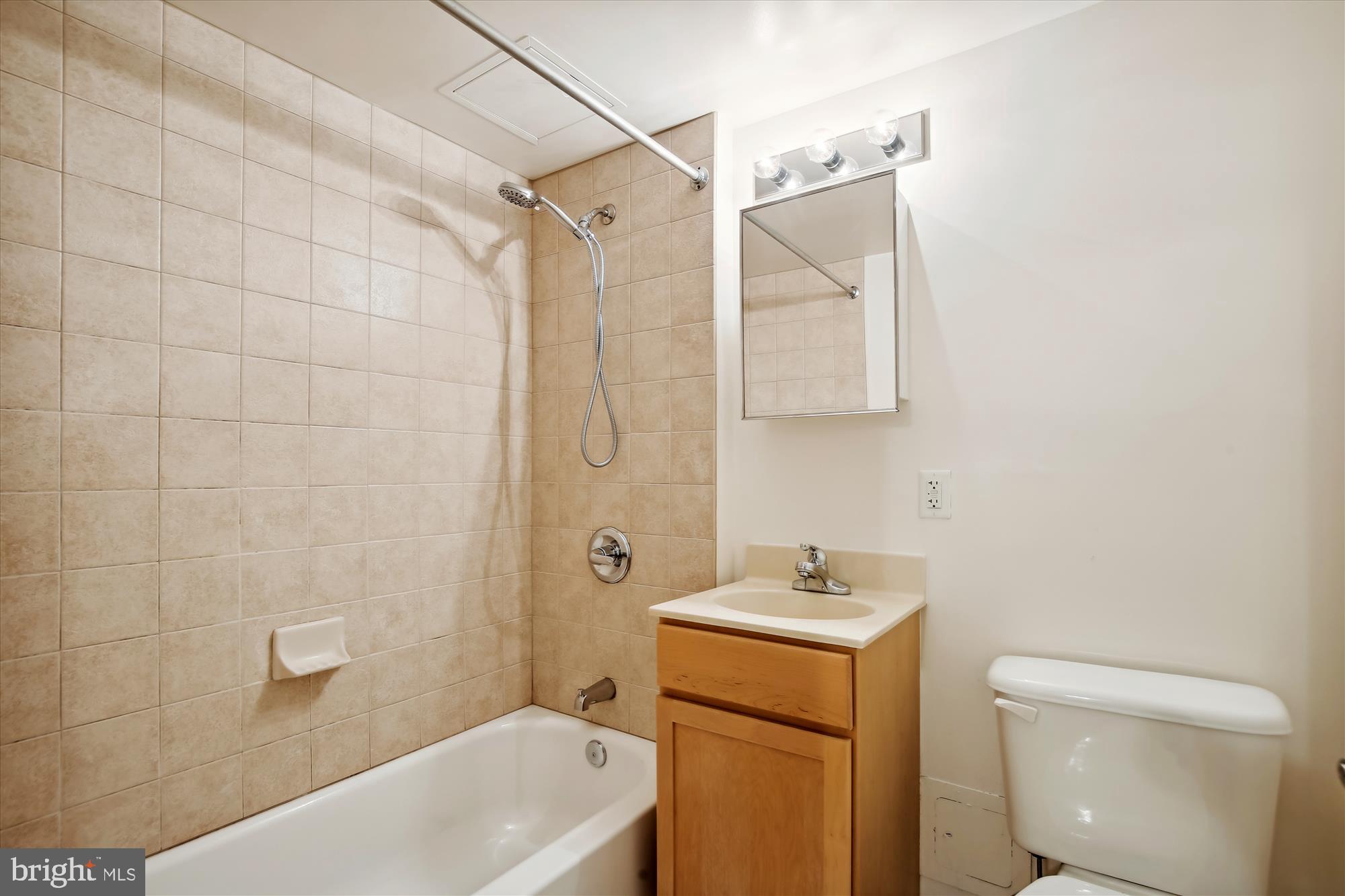800 4th Street Southwest, Unit S113 Washington, DC 20024 - Photo 20 of 37 a bathroom with a sink a toilet and shower