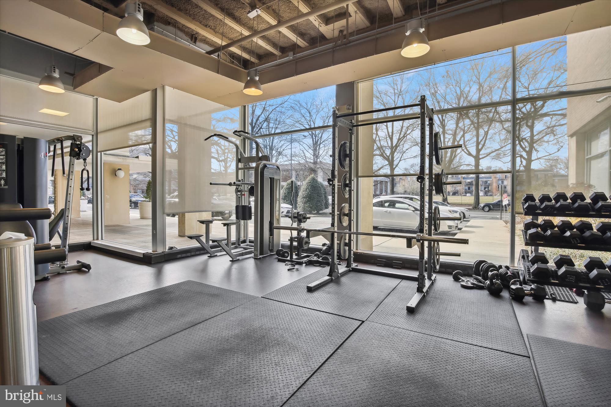 800 4th Street Southwest, Unit S113 Washington, DC 20024 - Photo 29 of 37 a room with gym equipment and large mirror