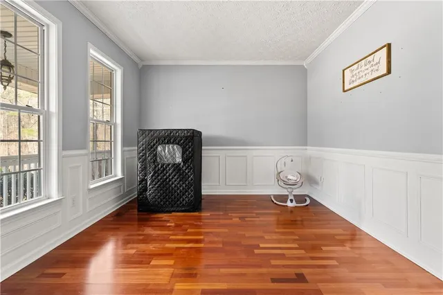 a room with a window and gym equipment