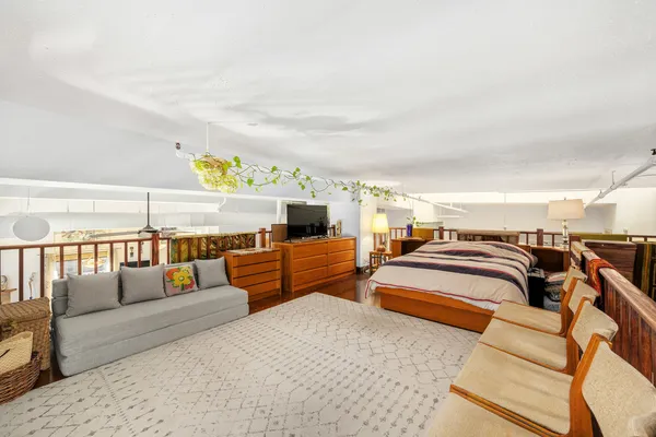 a bedroom with furniture and a couch