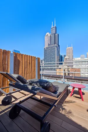 a view of roof deck with patio