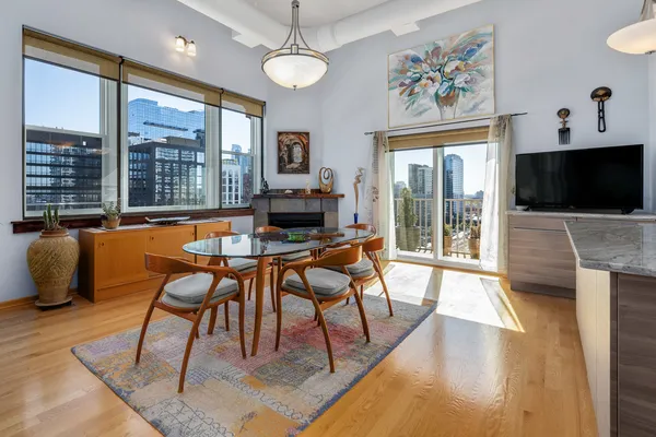 a view of a dining room with furniture window and wooden floor