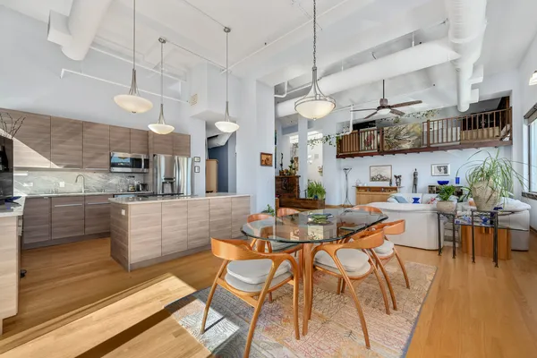 a view of a kitchen and dining area