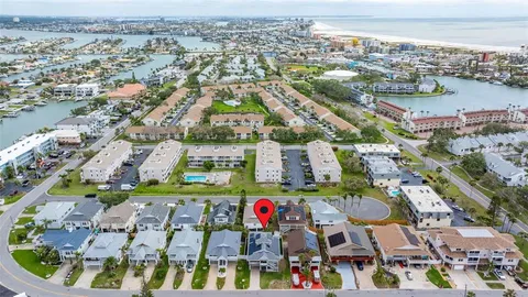 an aerial view of residential houses with outdoor space