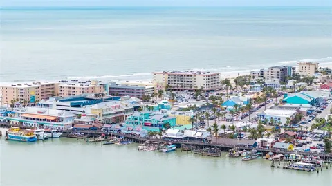 an aerial view of a city with lawn chairs