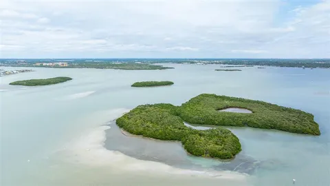 a view of a lake with a big yard