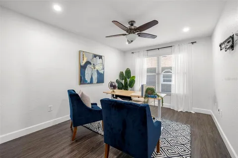 a view of a dining room with furniture and window