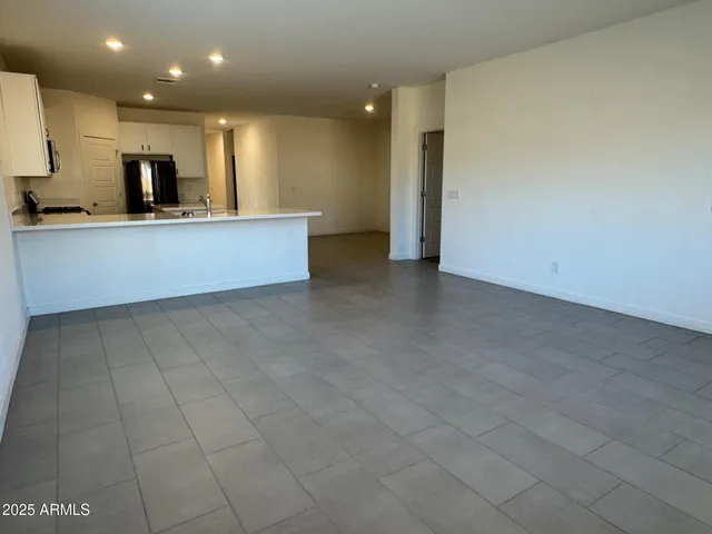 a kitchen with a sink and wooden cabinets