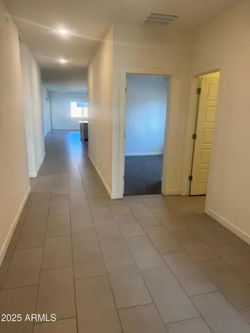 a view of hallway with livingroom