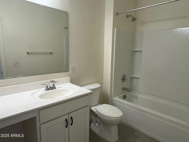 an empty room with closet area