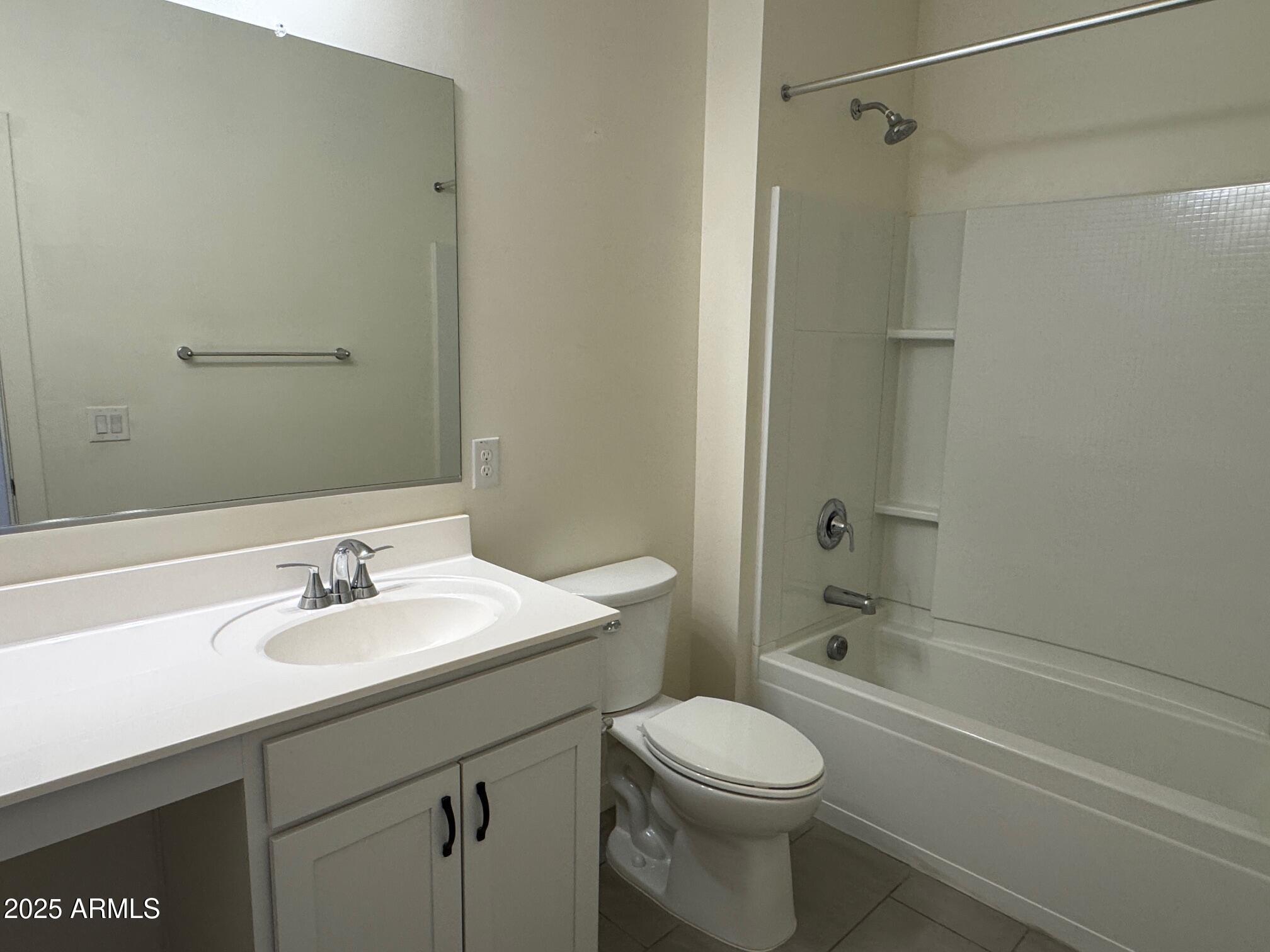 724 East Ruby Drive Casa Grande, AZ 85122 - Photo 4 of 20 a bathroom with a sink a toilet and shower