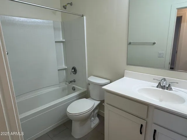 an empty room with closet area