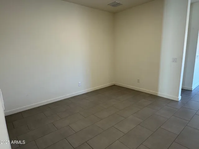 a kitchen with cabinets stainless steel appliances and a counter space