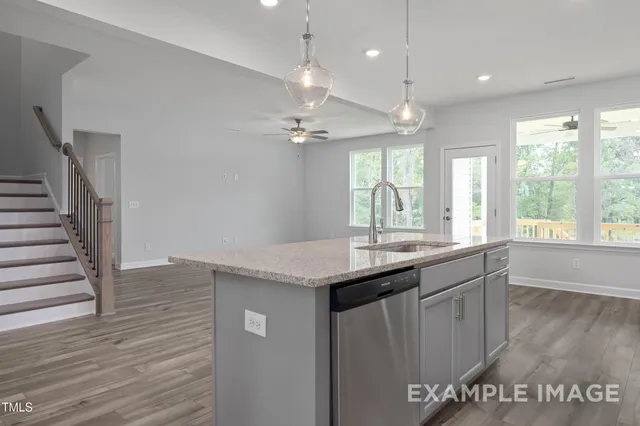a view of a kitchen counter space and wooden floor