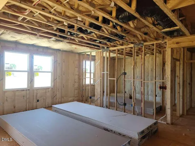 a room with a bed and a window