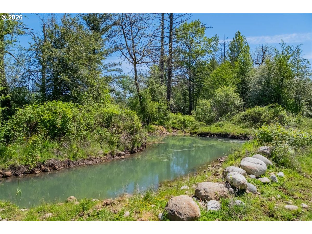 35377 Ede Road Lebanon, OR 97355 - Photo 46 of 48 a view of a lake with houses in the back