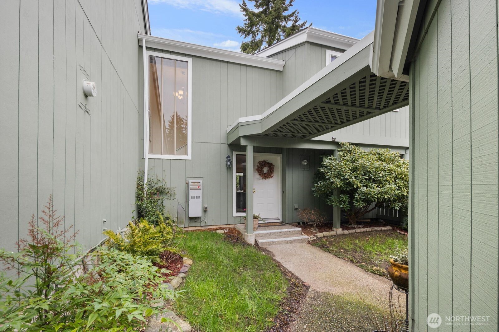 a front view of a house with garden