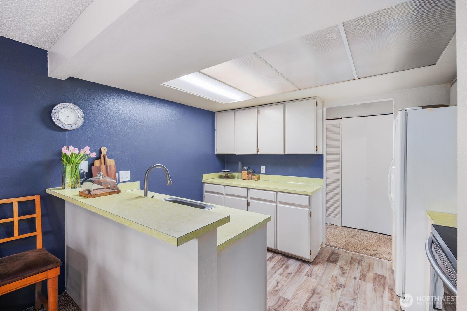 3114 Southwest 319th Place, Unit 45 Federal Way, WA 98023 - Photo 11 of 39 a kitchen with a cabinets and appliances