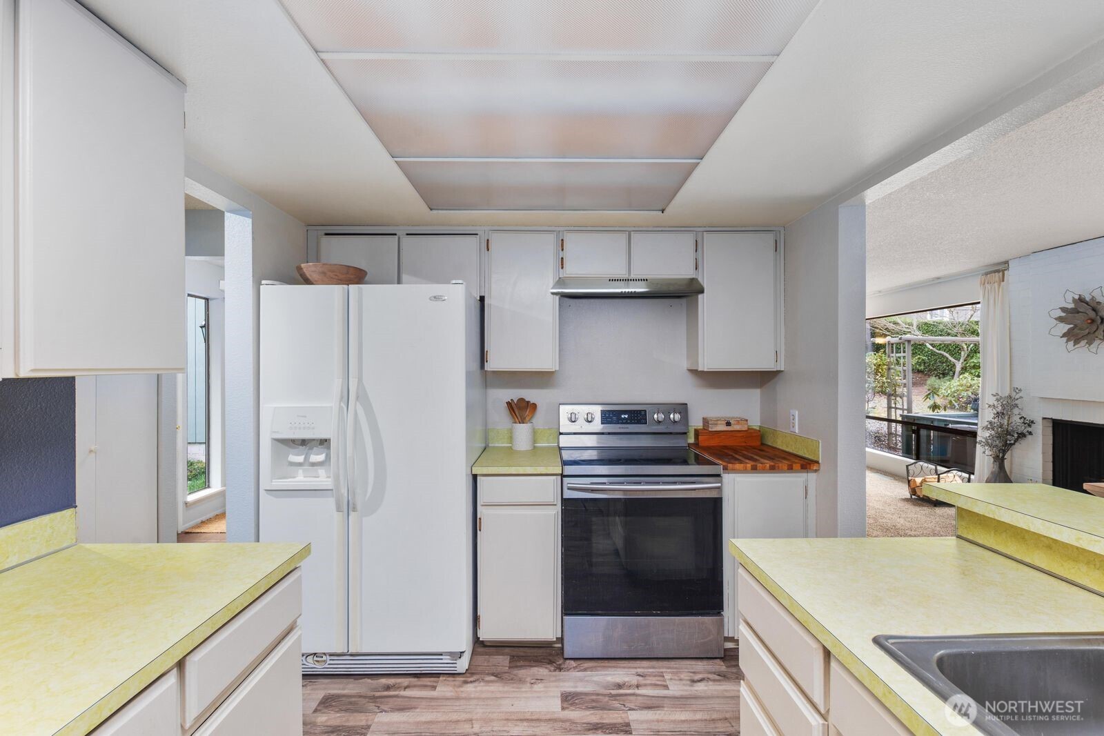 3114 Southwest 319th Place, Unit 45 Federal Way, WA 98023 - Photo 12 of 39 a kitchen with stainless steel appliances a refrigerator and a sink