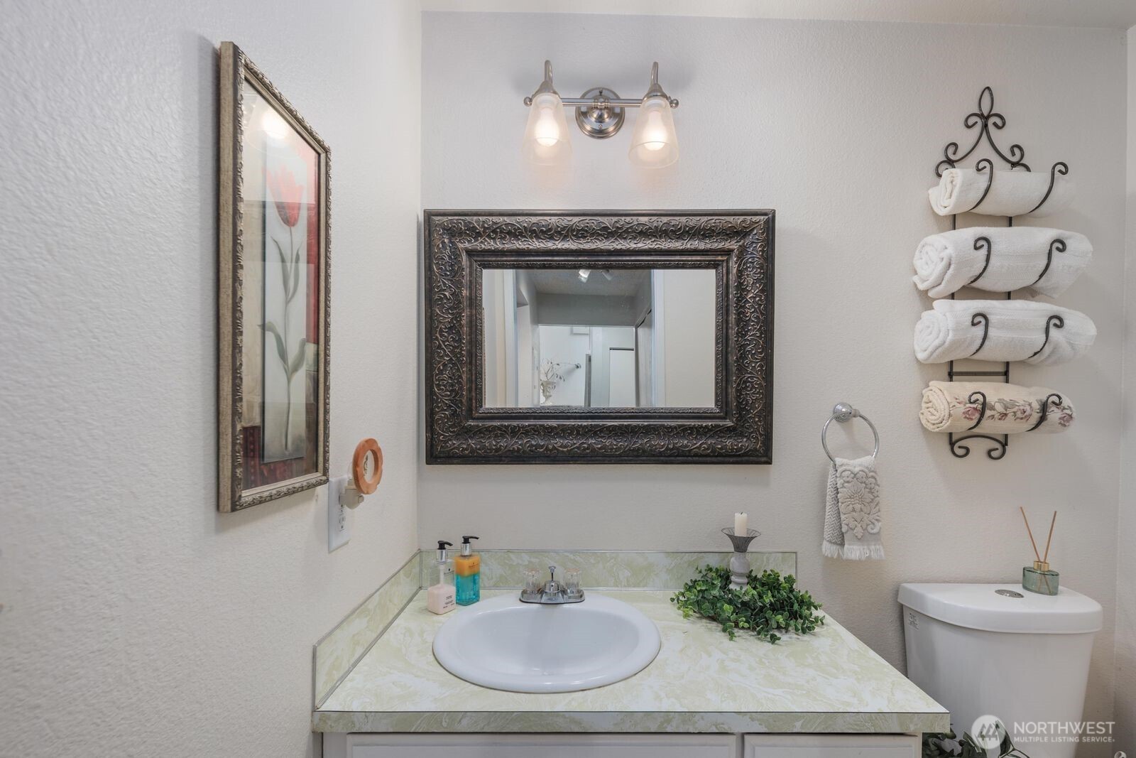3114 Southwest 319th Place, Unit 45 Federal Way, WA 98023 - Photo 14 of 39 a bathroom with a sink and a mirror