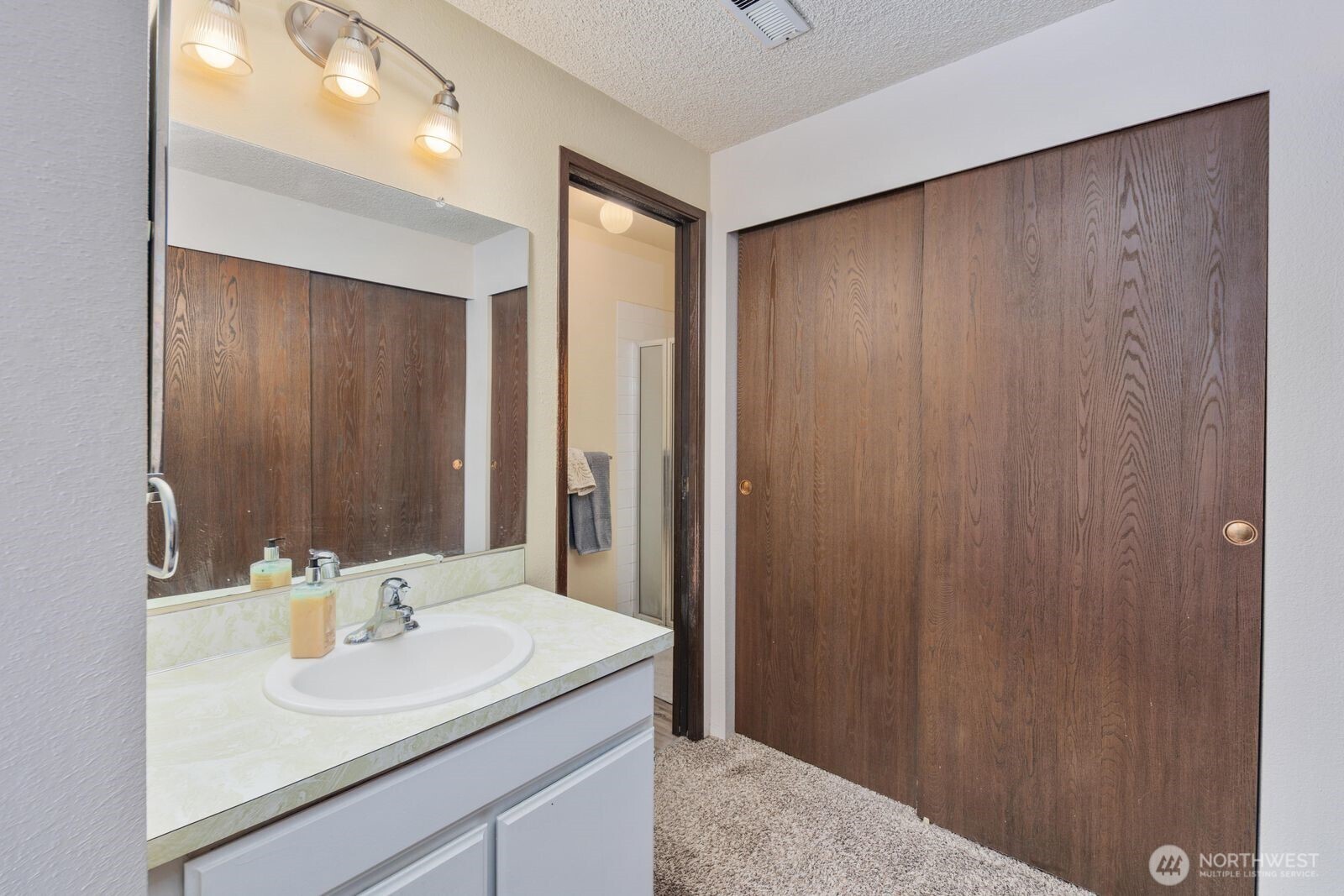 3114 Southwest 319th Place, Unit 45 Federal Way, WA 98023 - Photo 18 of 39 a bathroom with a sink and a mirror