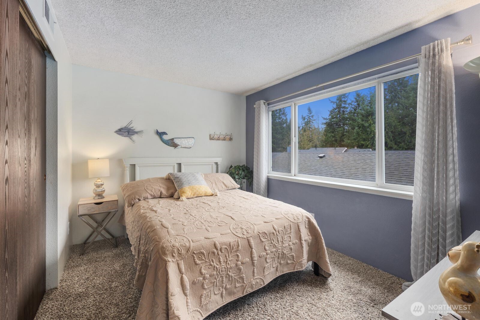 3114 Southwest 319th Place, Unit 45 Federal Way, WA 98023 - Photo 20 of 39 a bedroom with a bed and a large window