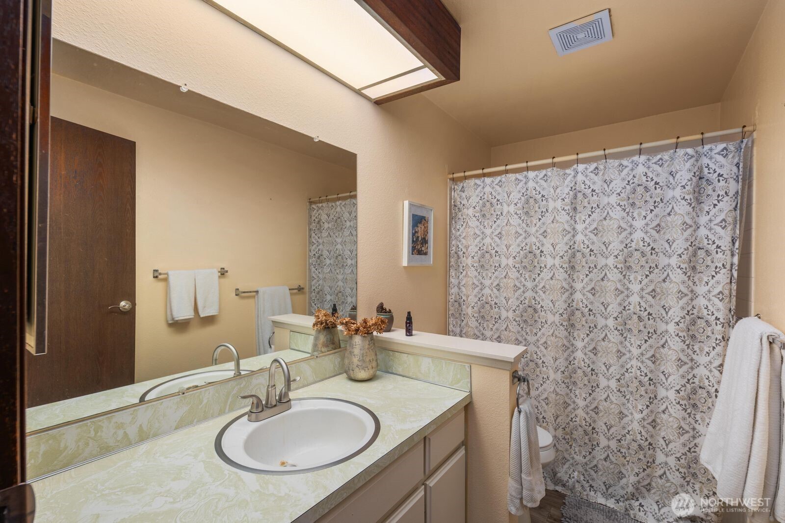 3114 Southwest 319th Place, Unit 45 Federal Way, WA 98023 - Photo 22 of 39 a bathroom with a sink and a mirror