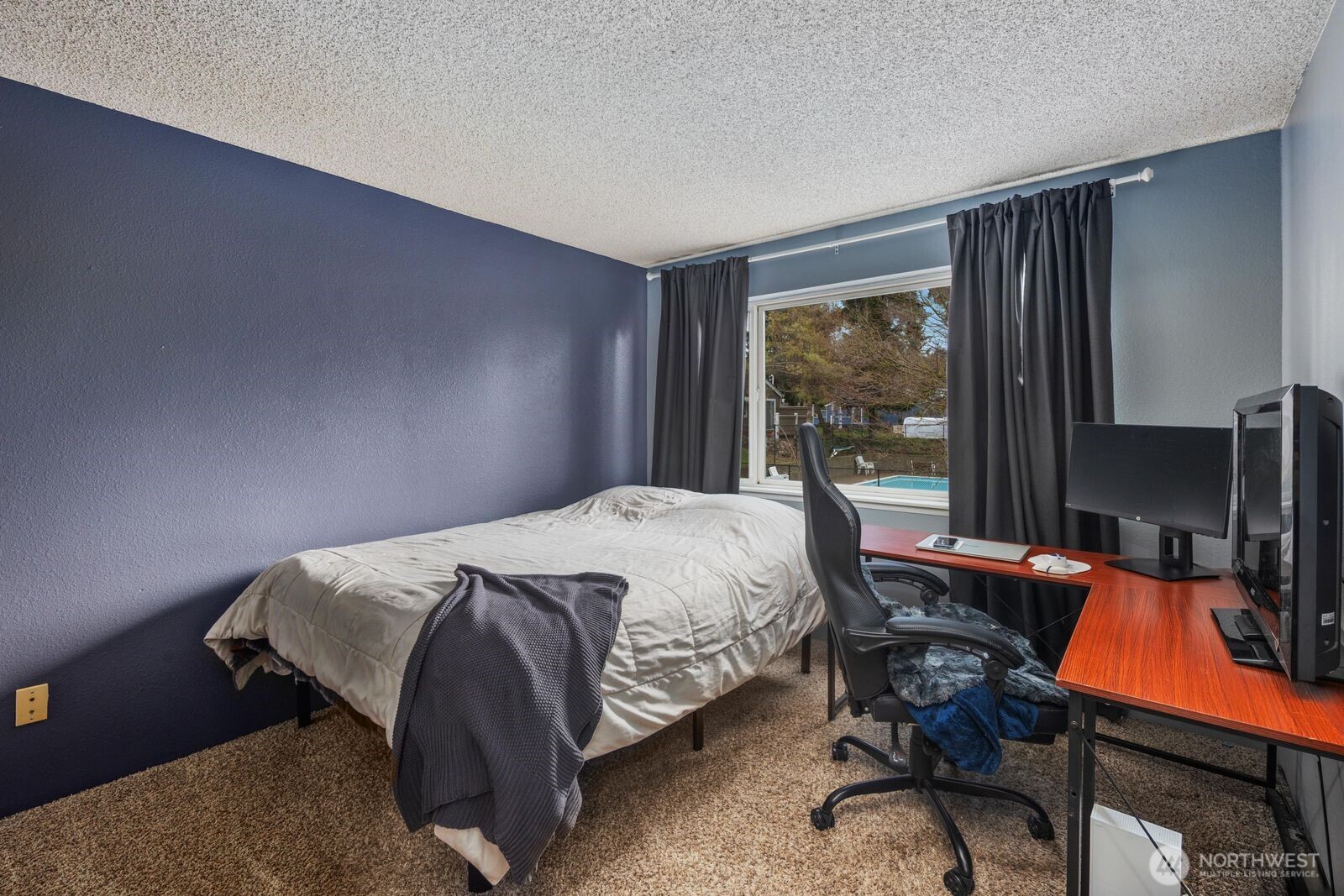 3114 Southwest 319th Place, Unit 45 Federal Way, WA 98023 - Photo 23 of 39 a bed sitting in a room next to a window