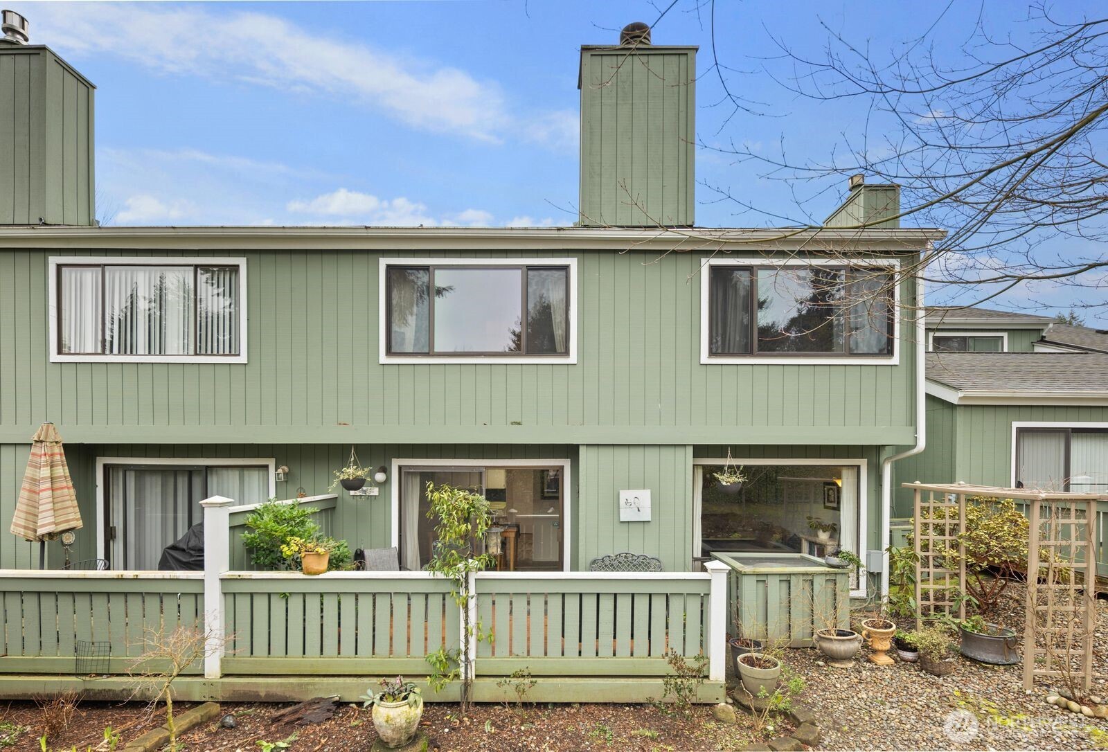 3114 Southwest 319th Place, Unit 45 Federal Way, WA 98023 - Photo 25 of 39 a front view of a house with a porch