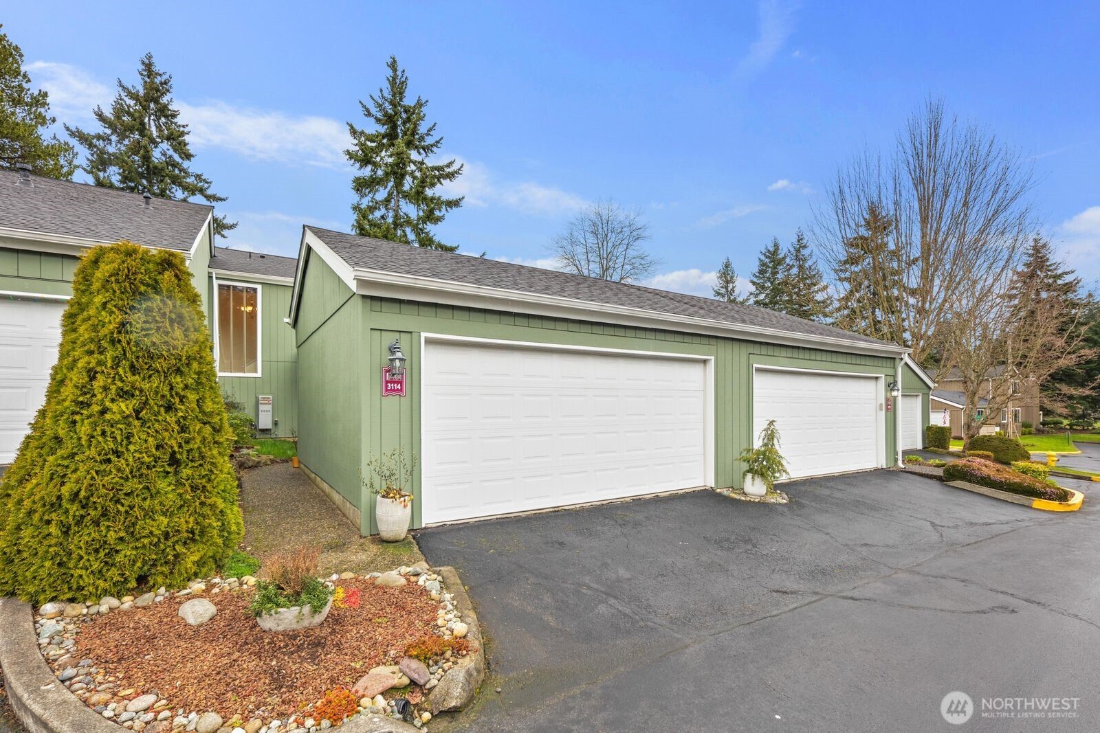 3114 Southwest 319th Place, Unit 45 Federal Way, WA 98023 - Photo 27 of 39 a front view of a house with a yard