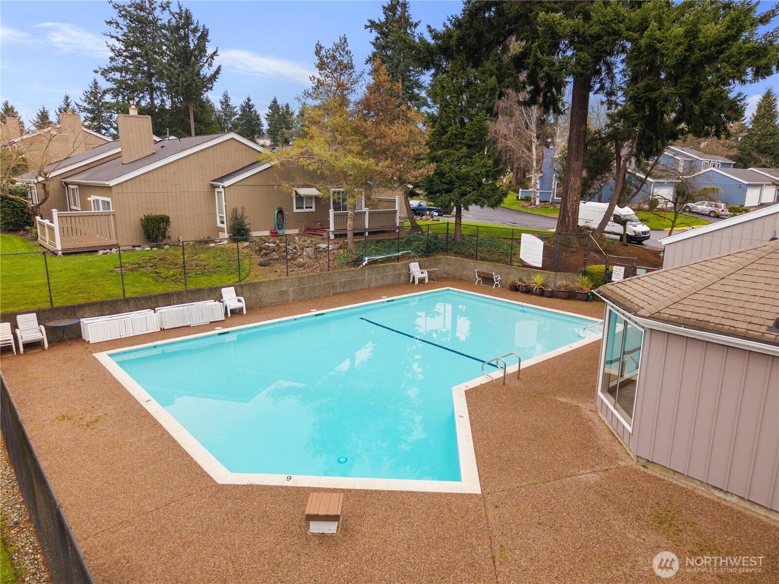 3114 Southwest 319th Place, Unit 45 Federal Way, WA 98023 - Photo 29 of 39 a view of a swimming pool with a patio