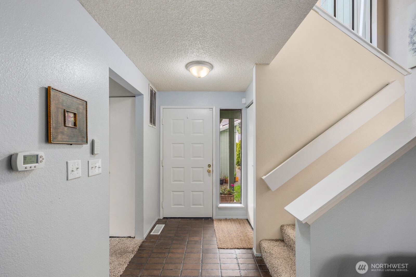3114 Southwest 319th Place, Unit 45 Federal Way, WA 98023 - Photo 4 of 39 a view of a hallway with wooden floor and entryway