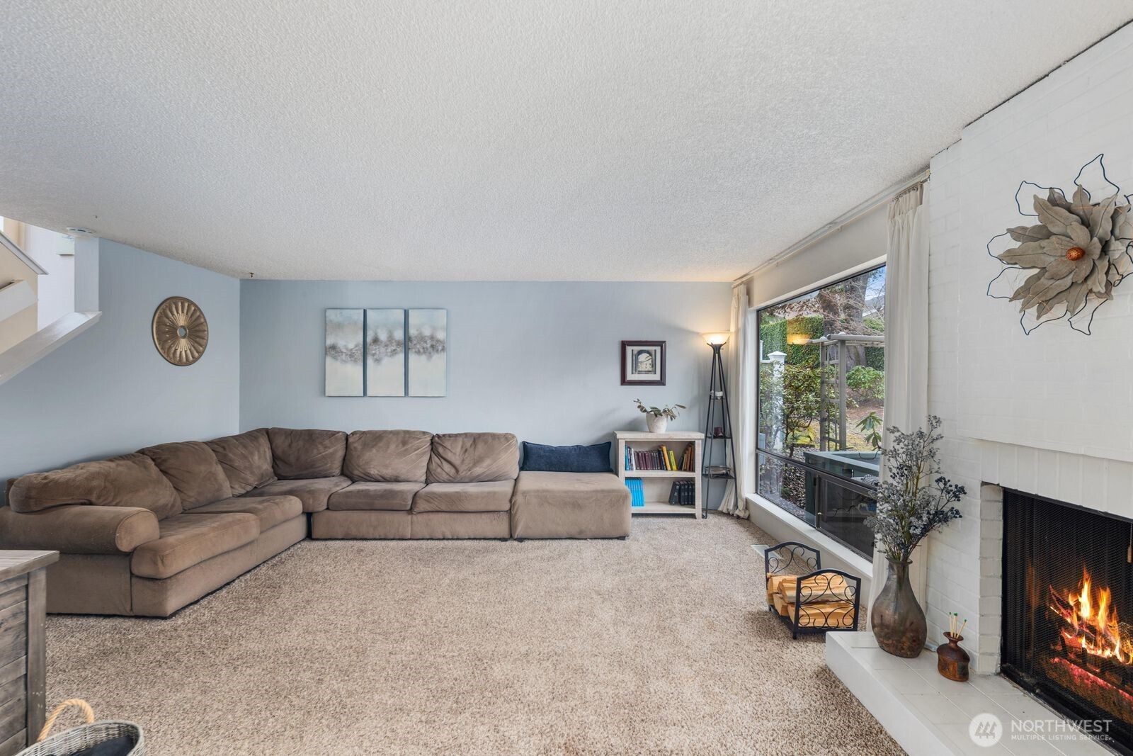 3114 Southwest 319th Place, Unit 45 Federal Way, WA 98023 - Photo 7 of 39 a living room with furniture and a flat screen tv