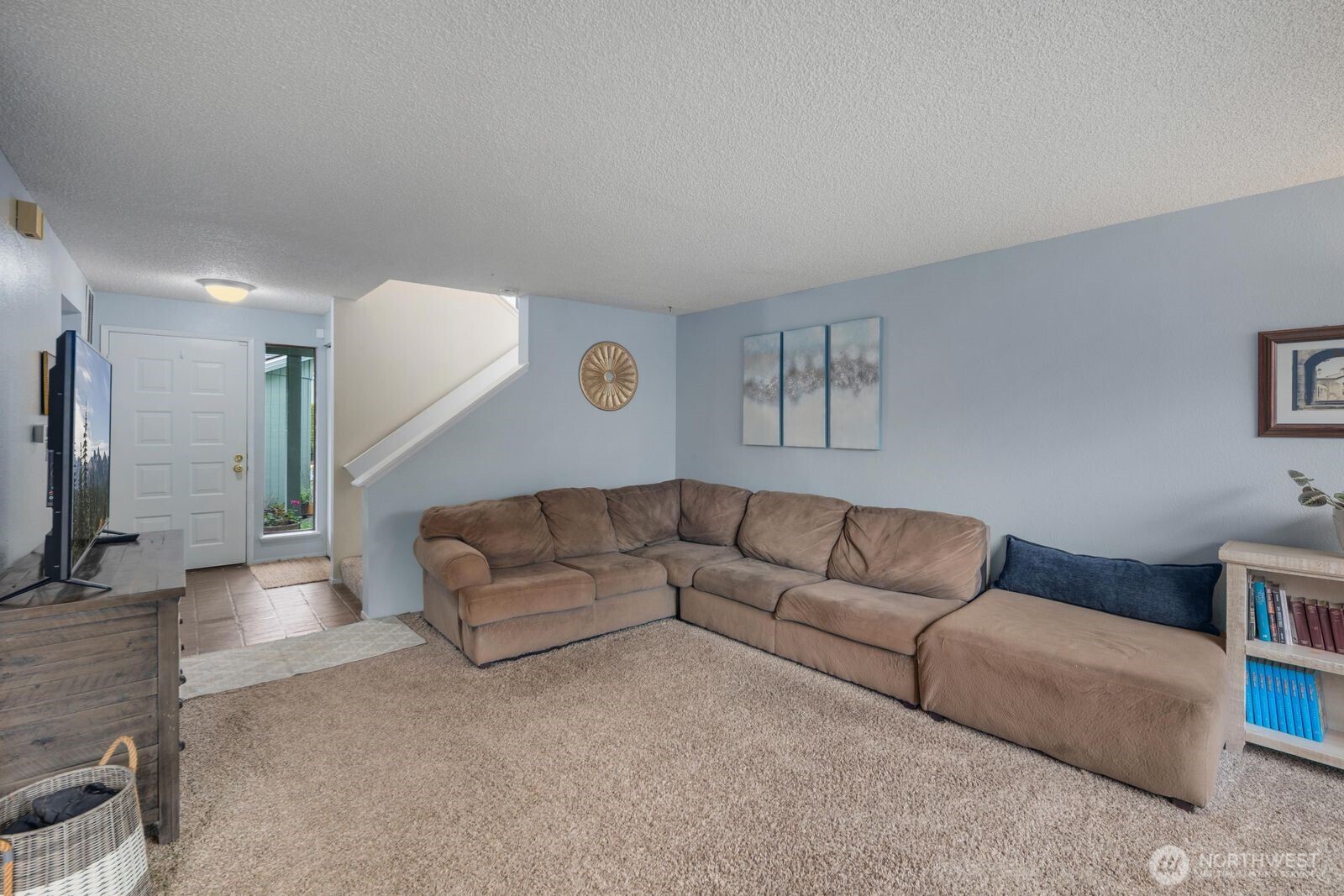 3114 Southwest 319th Place, Unit 45 Federal Way, WA 98023 - Photo 8 of 39 a living room with furniture and a flat screen tv