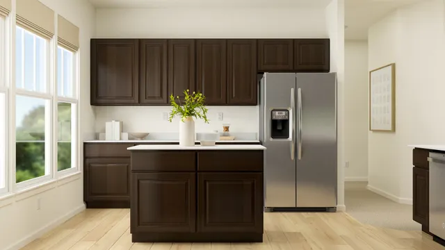 a kitchen with a refrigerator and a sink