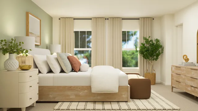 a bedroom with furniture and a potted plant