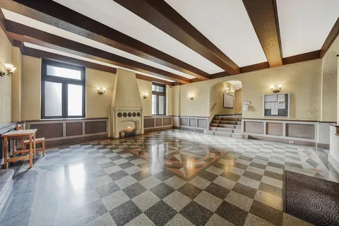 a view of a lobby with table and chair