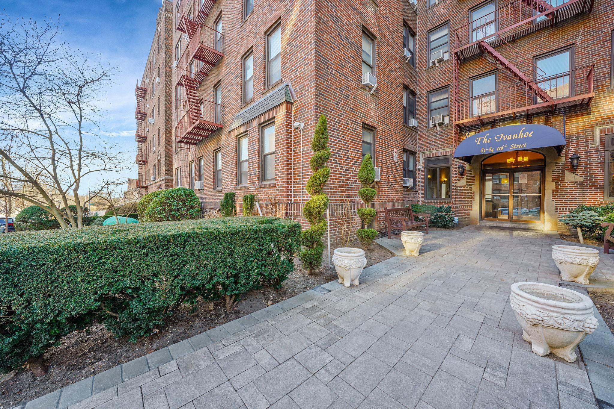 83-84 116th Street, Unit 1H Queens, NY 11418 - Photo 12 of 13 a view of a building with sitting area