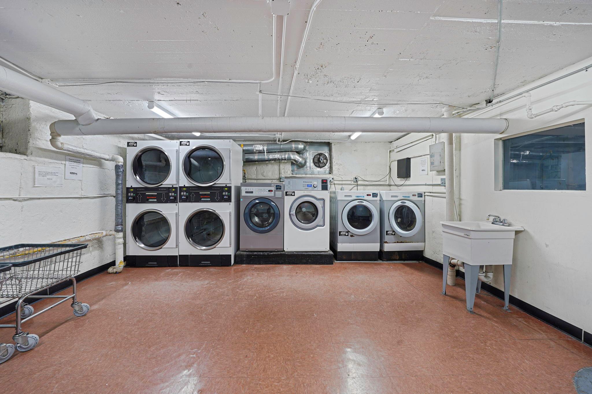 83-84 116th Street, Unit 1H Queens, NY 11418 - Photo 10 of 13 a utility room with dryer and washer