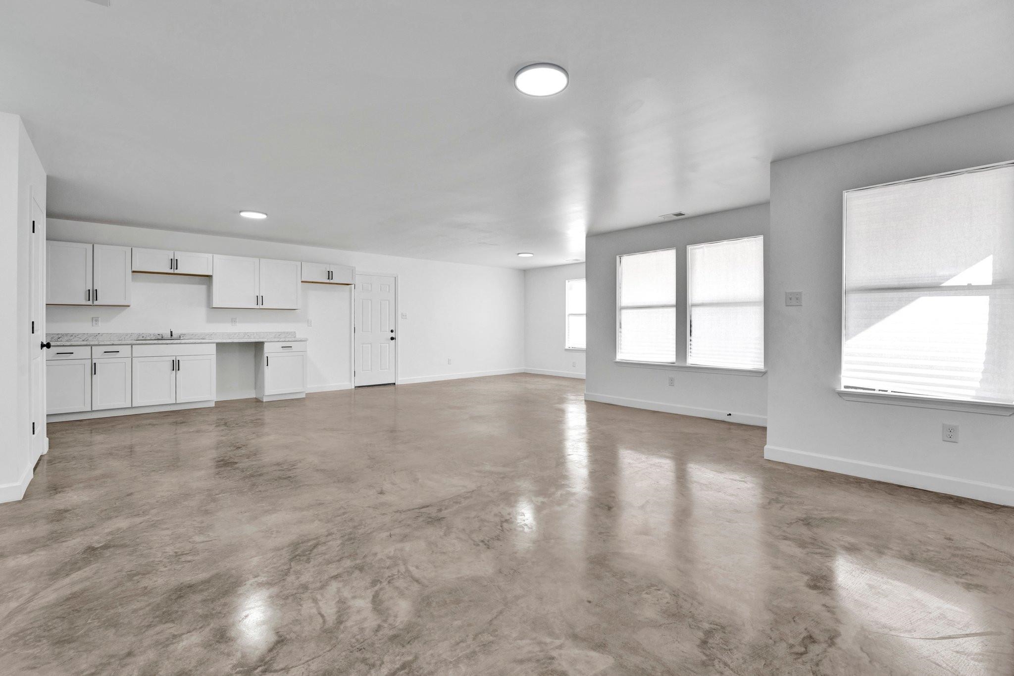 630 King Road Memphis, TN 38109 - Photo 18 of 27 Unfurnished living room with concrete floors and sink