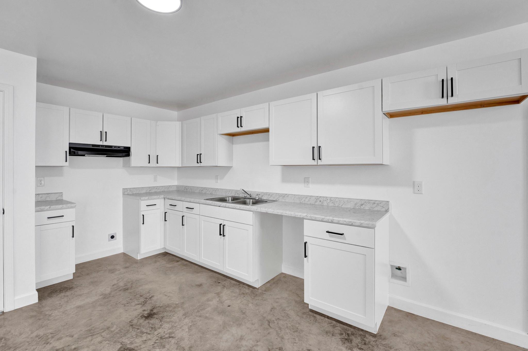 630 King Road Memphis, TN 38109 - Photo 5 of 27 Kitchen with sink and white cabinetry
